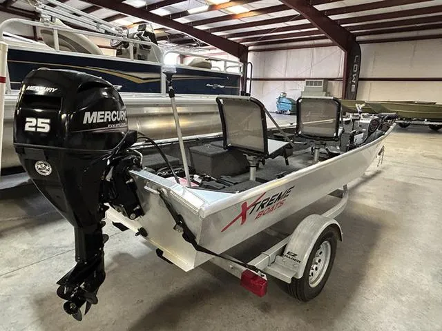 Slide: The Image of 2021 XTREME BOATS River Skiff 15452 SS with Mercury 25 engine in a warehouse. - 12