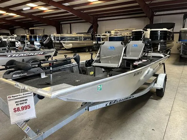 Slide: The Image of 2021 XTREME BOATS River Skiff 15452 SS on trailer, priced at $8,995 in showroom. - 2