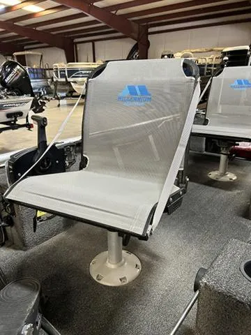 Slide: The Image of 2021 XTREME BOATS River Skiff 15452 SS interior with comfortable seating in showroom. - 5