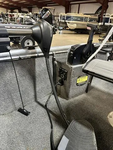 Slide: The Image of 2021 XTREME BOATS River Skiff 15452 SS interior with steering and control panel. - 6