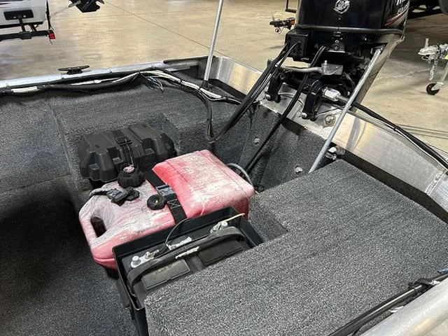 Slide: The Image of 2021 XTREME BOATS River Skiff 15452 SS interior with motor and fuel tank. - 9