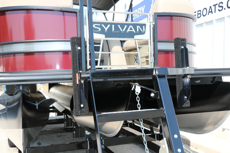 Slide: The Image of 2025 Sylvan L3 CLZ DH pontoon boat rear view with ladder and logo. - 10