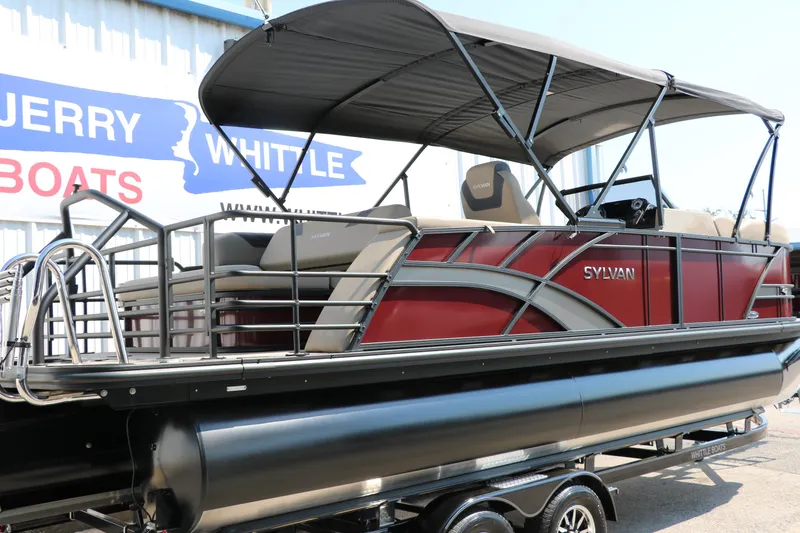 Slide: The Image of 2025 Sylvan L3 CLZ DH pontoon boat with canopy, displayed on a trailer. - 2
