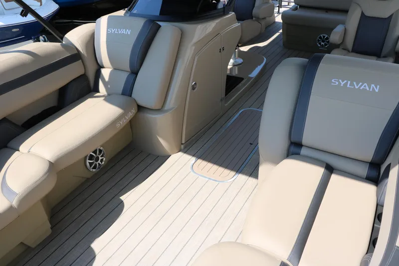 Slide: The Image of Luxurious interior of 2025 Sylvan L3 CLZ DH boat with beige seating and wood flooring. - 21