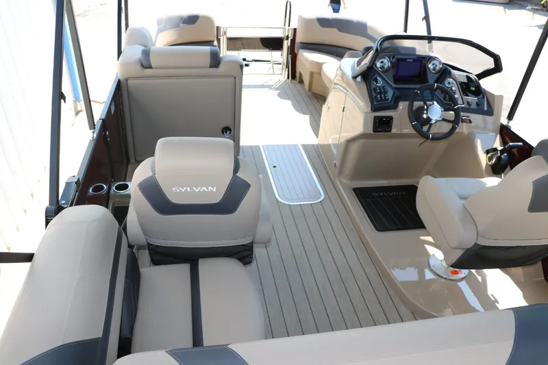 Slide: The Image of 2025 Sylvan L3 CLZ DH boat interior with modern dashboard and comfortable seating. - 28