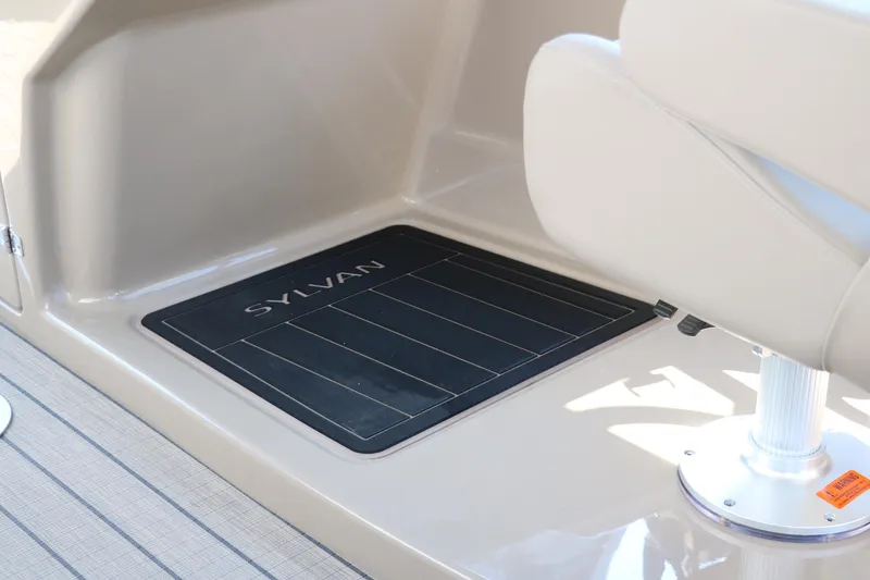 Slide: The Image of 2025 Sylvan L3 CLZ DH boat interior with branded floor mat and seating. - 30