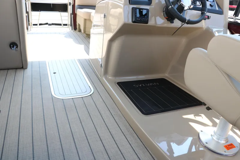 Slide: The Image of Interior of 2025 Sylvan L3 CLZ DH boat with sleek design and modern steering console. - 31