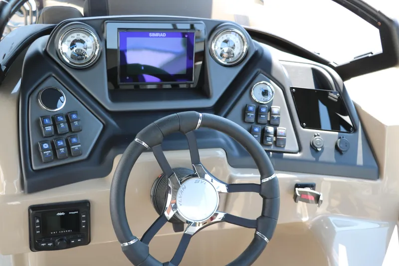 Slide: The Image of Steering console of 2025 Sylvan L3 CLZ DH boat with modern controls and display. - 32