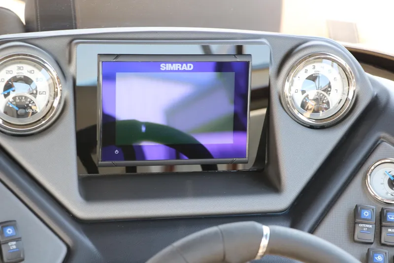 Slide: The Image of Dashboard of 2025 Sylvan L3 CLZ DH with Simrad display and gauges. - 33