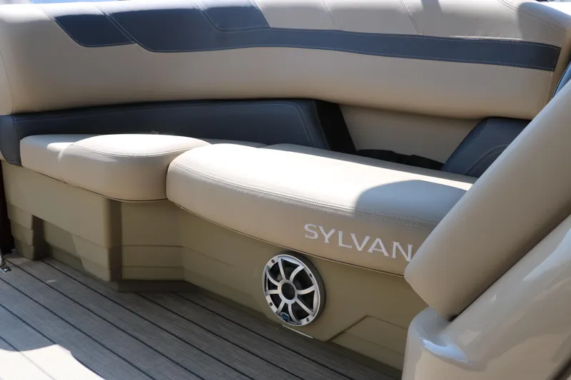 Slide: The Image of 2025 Sylvan L3 CLZ DH boat interior with beige seating and speaker. - 35