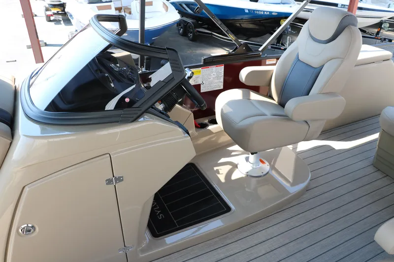 Slide: The Image of 2025 Sylvan L3 CLZ DH boat cockpit with captain's chair and steering console. - 36