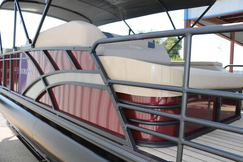 Slide: The Image of 2025 Sylvan L3 CLZ DH pontoon boat with sleek red and beige design. - 6