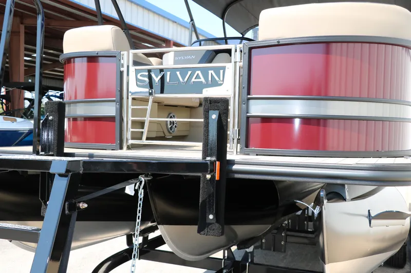 Slide: The Image of 2025 Sylvan L3 CLZ DH pontoon boat with red panels and ladder. - 8
