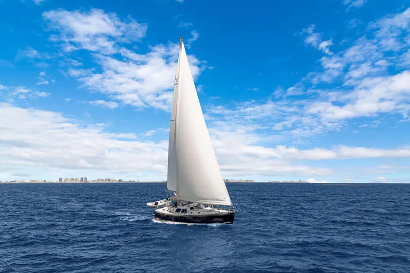 Slide: The Image of Sailing yacht Hylas 54 (2009) on open ocean under clear blue sky. - 13