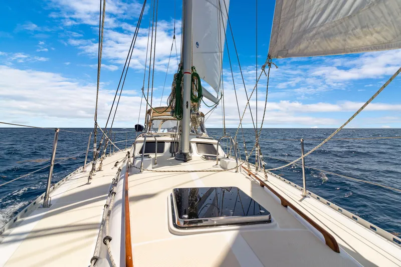 Slide: The Image of Sailing on a 2009 Hylas 54 yacht under clear blue skies. - 17