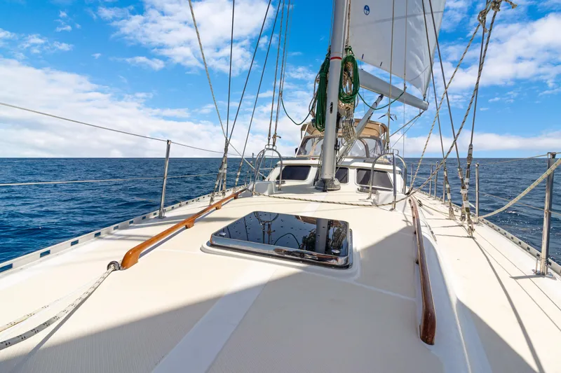 Slide: The Image of Sailing on a 2009 Hylas 54 yacht under clear blue skies. - 18