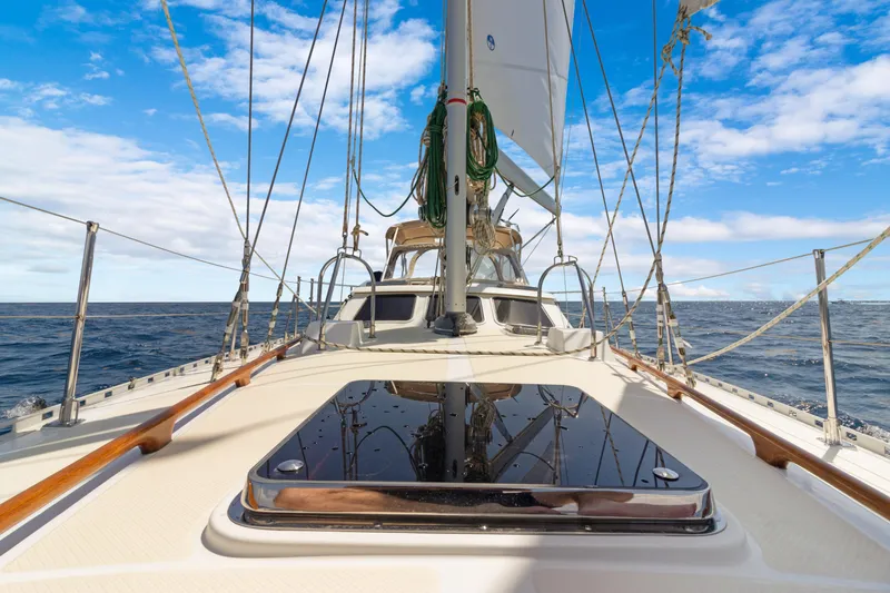Slide: The Image of Sailing on a 2009 Hylas 54 yacht under clear blue skies. - 19
