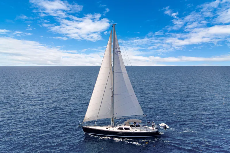 Slide: The Image of Sailing yacht Hylas 54, 2009 model, cruising on open ocean under clear blue sky. - 2