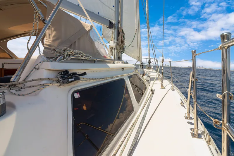Slide: The Image of Sailing yacht Hylas 54, 2009 model, cruising on open water under a clear blue sky. - 21