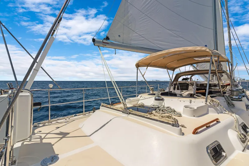 Slide: The Image of Sailing on a 2009 Hylas 54 yacht under clear blue skies. - 23