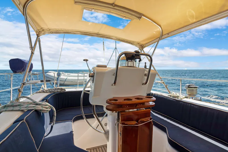 Slide: The Image of Cockpit view of 2009 Hylas 54 yacht with ocean backdrop. - 28