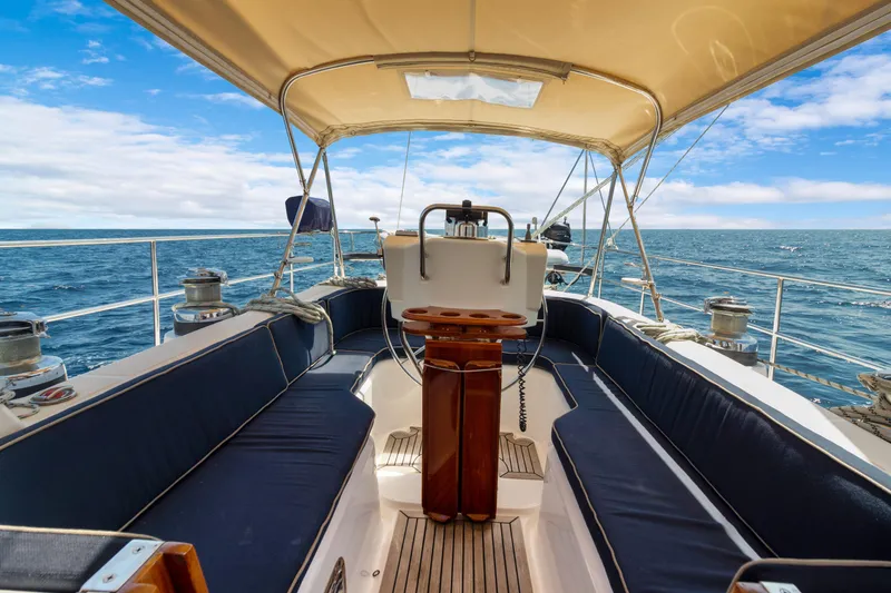 Slide: The Image of Cockpit view of 2009 Hylas 54 yacht sailing on open sea under blue sky. - 29