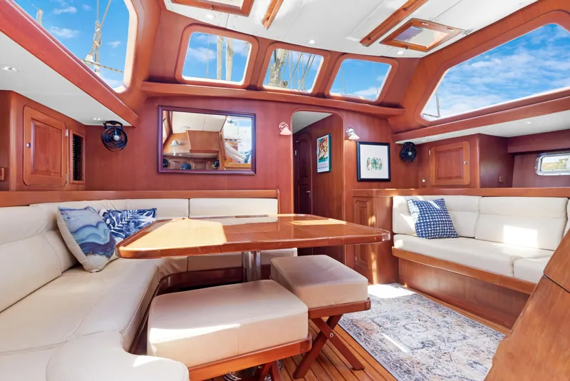Slide: The Image of Luxurious interior of a 2009 Hylas 54 yacht with elegant wood finishes and plush seating. - 31