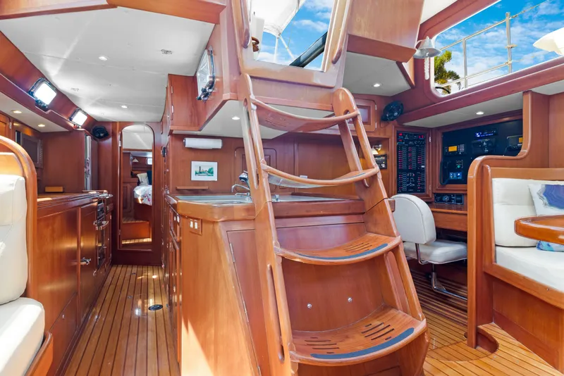 Slide: The Image of Interior of 2009 Hylas 54 yacht with wooden finishes and modern navigation equipment. - 35