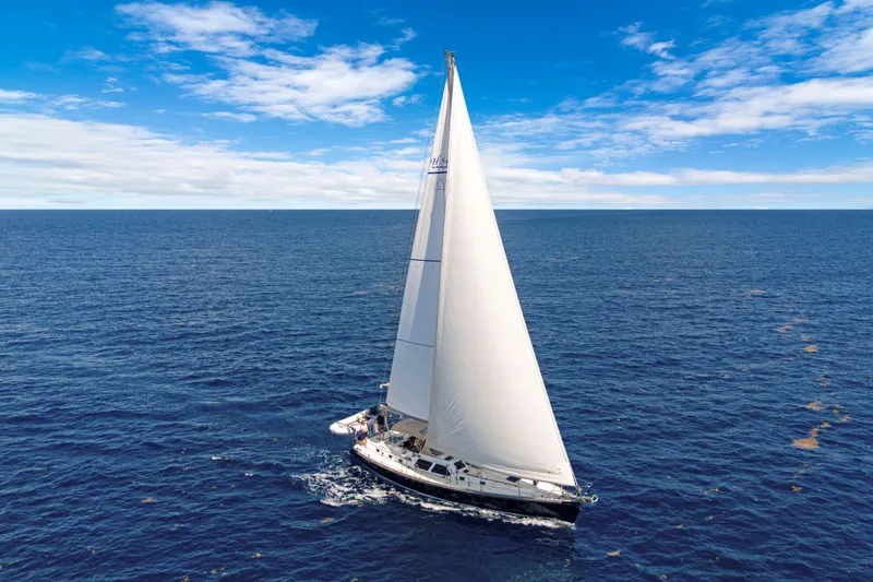 Slide: The Image of Sailing yacht Hylas 54, 2009 model, cruising on open ocean under clear blue skies. - 4