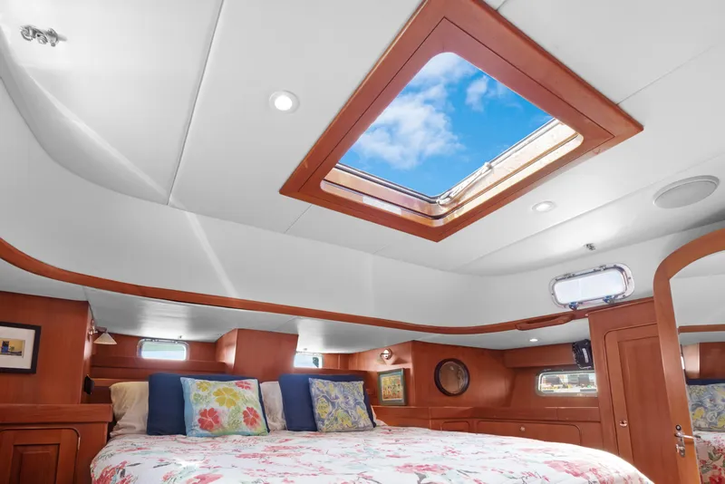 Slide: The Image of Luxurious cabin interior of 2009 Hylas 54 yacht with skylight and cozy bedding. - 43