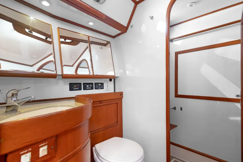 Slide: The Image of Luxurious bathroom in a 2009 Hylas 54 yacht, featuring wood accents and modern fixtures. - 47