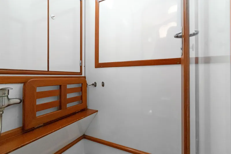 Slide: The Image of Interior of 2009 Hylas 54 yacht featuring wooden trim and white paneling. - 48