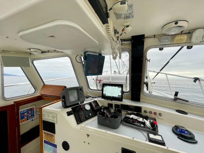Slide: The Image of Interior view of a 2004 Beal 34 boat cockpit with navigation equipment. - 12