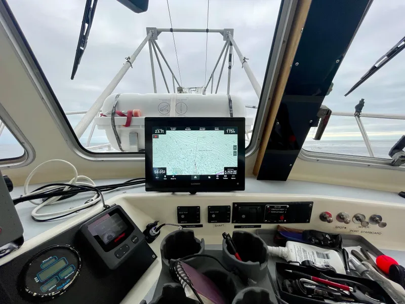 Slide: The Image of Cockpit view of a Beal 34 boat, featuring navigation equipment and controls, 2004 model. - 15