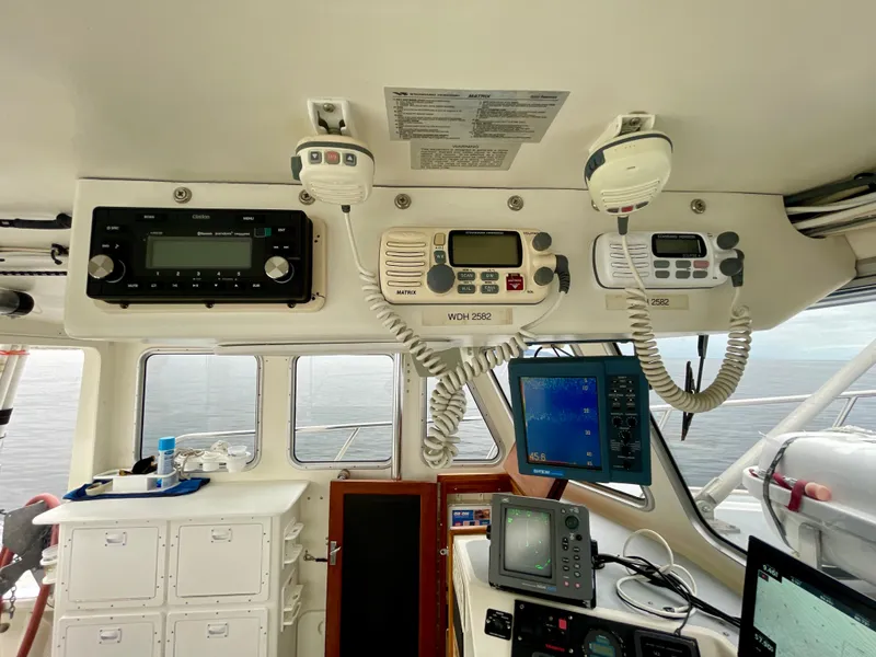 Slide: The Image of Interior of a 2004 Beal 34 boat showing navigation and communication equipment. - 16
