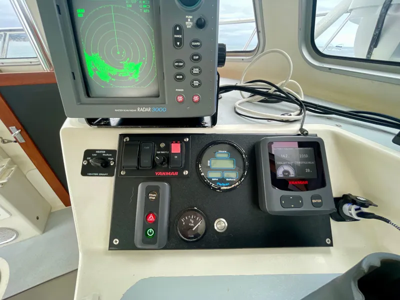 Slide: The Image of Boat control panel with radar and Yanmar engine display, Beal 34, 2004 model. - 19