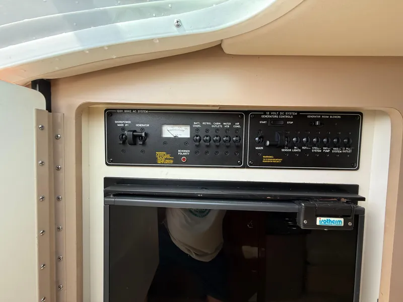 Slide: The Image of Control panel and appliance in 2004 Formula 330 Sun Sport boat interior. - 15