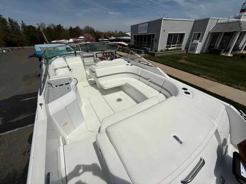 Slide: The Image of 2004 Formula 330 Sun Sport boat with spacious white seating and sleek design. - 4