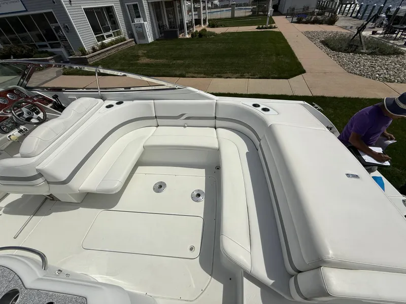 Slide: The Image of 2004 Formula 330 Sun Sport boat with spacious white seating area. - 5
