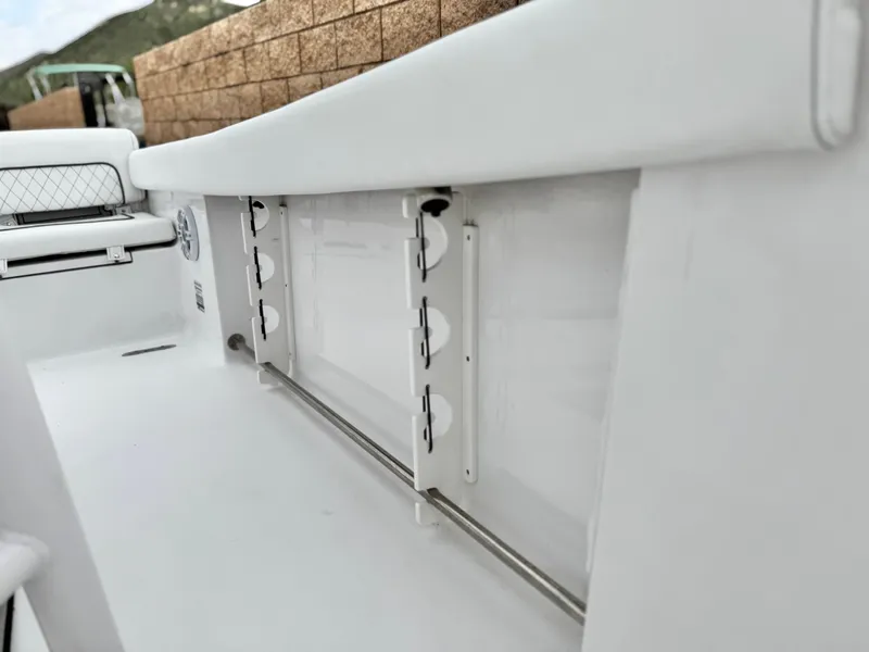 Slide: The Image of 2022 Sportsman Heritage 241 Center Console interior detail, showcasing sleek white design and storage features. - 16