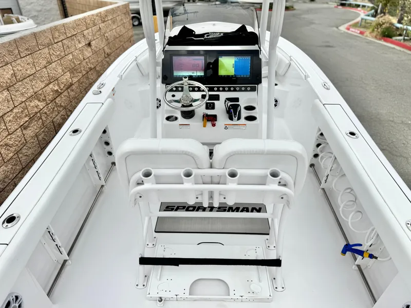 Slide: The Image of 2022 Sportsman Heritage 241 Center Console boat interior with modern dashboard and seating. - 20