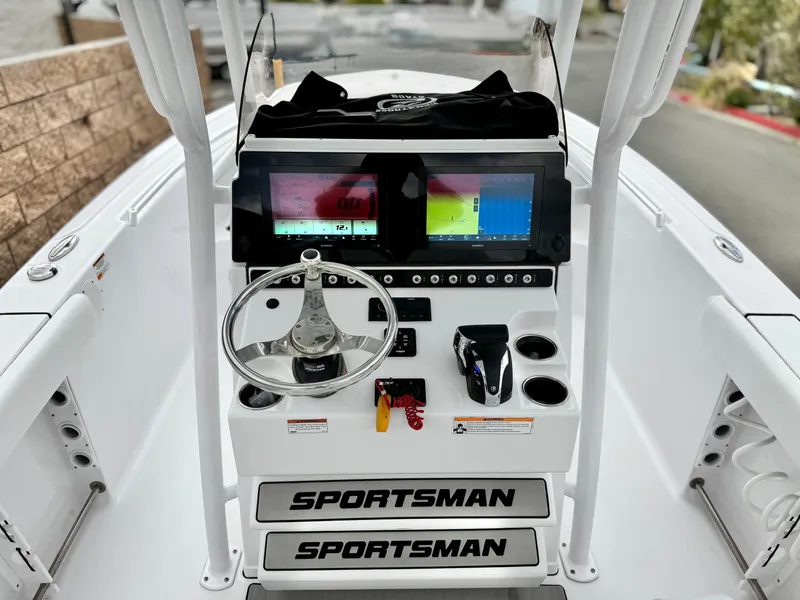 Slide: The Image of 2022 Sportsman Heritage 241 Center Console dashboard with dual screens and steering wheel. - 25