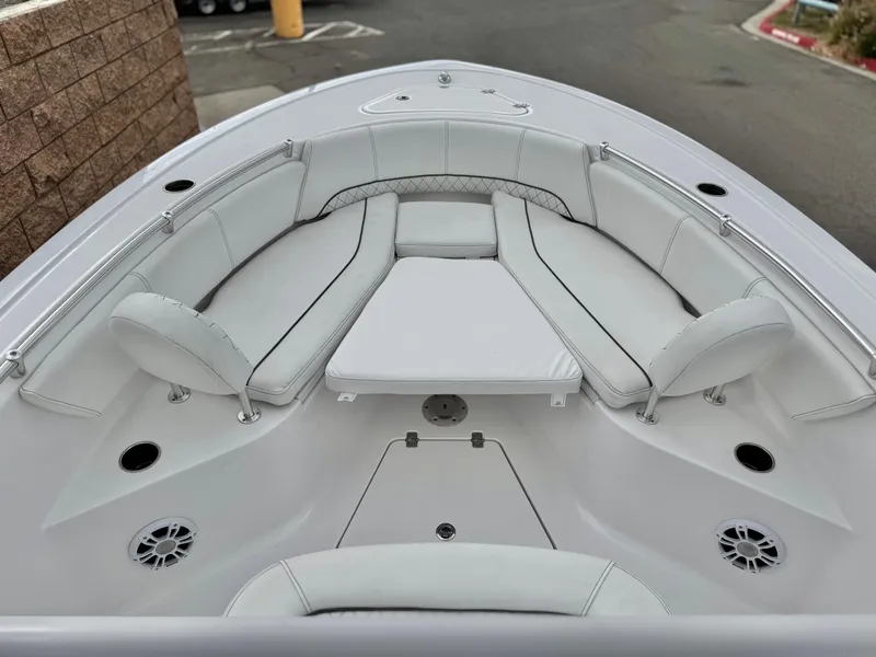 Slide: The Image of 2022 Sportsman Heritage 241 Center Console boat with spacious seating and modern design. - 8