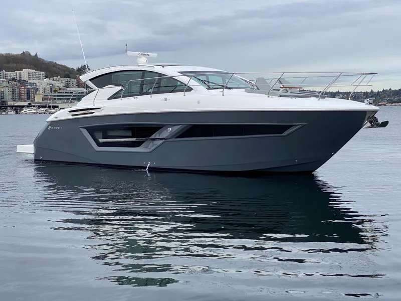 Slide: The Image of 2023 Cruisers Yachts 46 Cantius luxury boat on calm water, side view. - 0