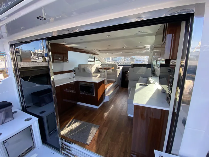 Slide: The Image of Luxurious interior of 2023 Cruisers Yachts 46 Cantius with modern furnishings and sleek design. - 10