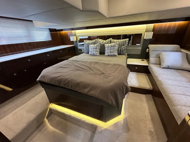 Slide: The Image of Luxurious bedroom interior of 2023 Cruisers Yachts 46 Cantius with modern design and ambient lighting. - 19