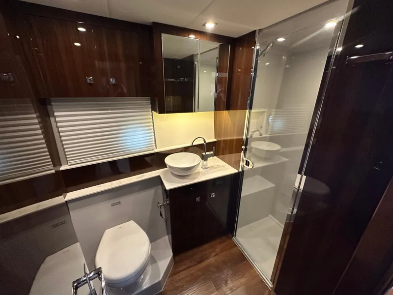 Slide: The Image of Luxurious bathroom in 2023 Cruisers Yachts 46 Cantius with modern fixtures and elegant design. - 28