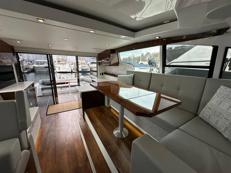 Slide: The Image of Luxurious interior of 2023 Cruisers Yachts 46 Cantius with elegant seating and dining area. - 30