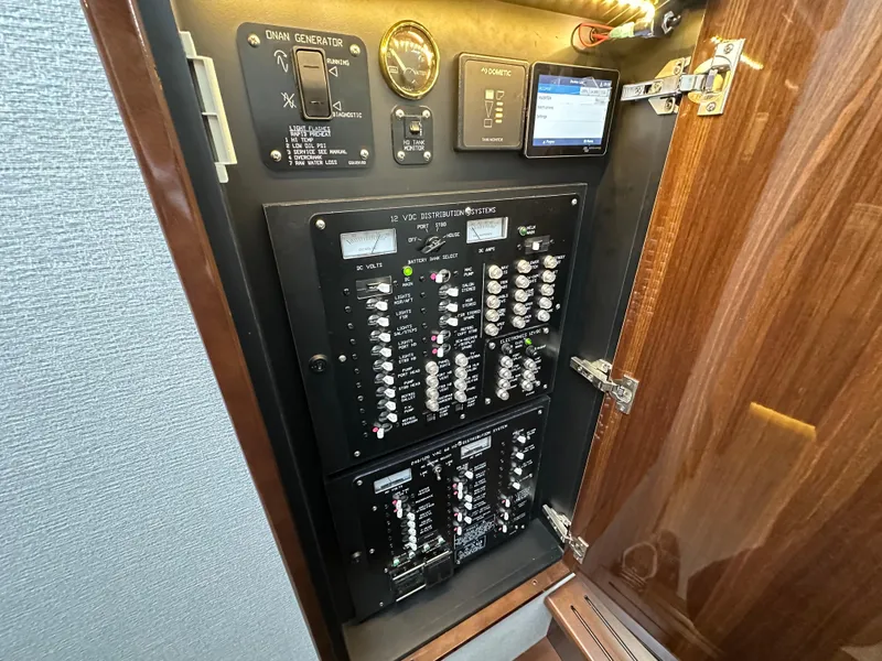 Slide: The Image of Electrical panel inside 2023 Cruisers Yachts 46 Cantius, showcasing switches and controls. - 31