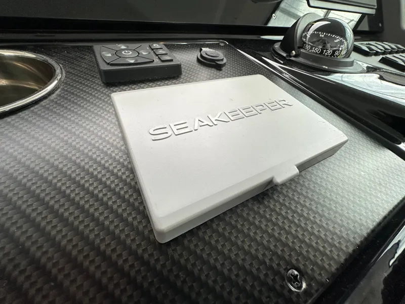 Slide: The Image of Dashboard of 2023 Cruisers Yachts 46 Cantius featuring Seakeeper control panel. - 33